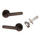 Pair of Iver Puerto lever handles on round rose, featuring a sleek, modern design in a polished finish.