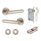 Pair of Iver Puerto lever handles on round rose, showcasing sleek metal design and polished finish.