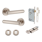 Pair of Iver Puerto lever handles on round rose plates, showcasing elegant brass finish and detailed design for door hardware.