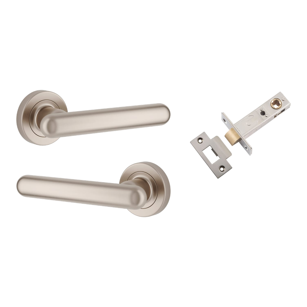 Pair of Iver Puerto Lever handles on round rose, showcasing polished metal finish and classic design for interior door hardware.