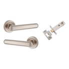 Pair of Iver Puerto Lever handles on round rose, showcasing polished metal finish and classic design for interior door hardware.
