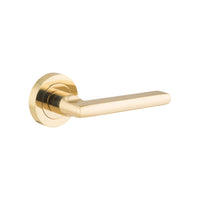 Pair of Iver Baltimore lever handles on round rose, featuring a sleek, modern design for interior doors.