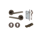 Pair of Iver Baltimore lever handles on round rose, featuring a sleek brass finish and modern design for interior doors.