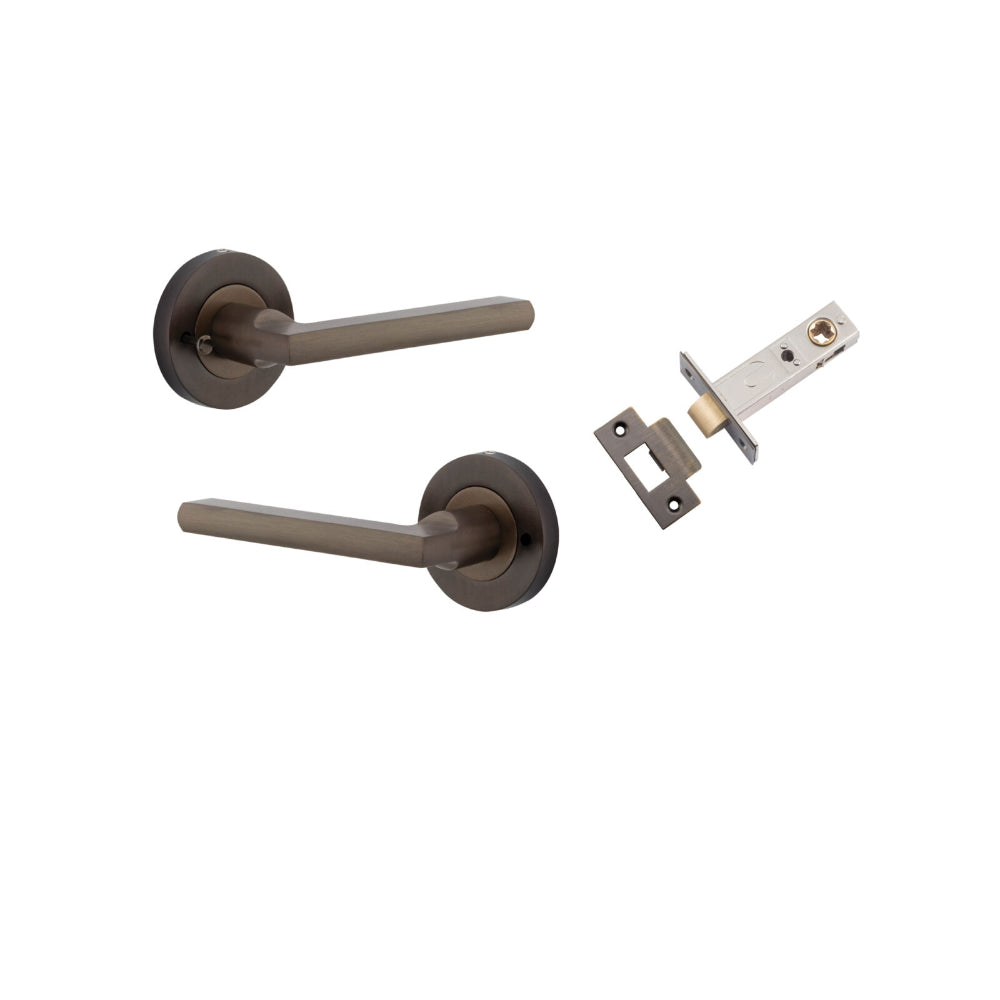 Pair of Iver Baltimore lever handles on round rose, featuring a sleek, modern design for doors.