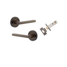 Pair of Iver Baltimore lever handles on round rose, featuring a sleek, modern design for doors.