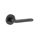 Pair of Iver Baltimore lever door handles on round rose, featuring a sleek, modern design in polished finish.