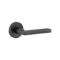 Pair of Iver Baltimore lever door handles on round rose, featuring a sleek, modern design in polished finish.