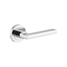 Pair of Iver Baltimore lever door handles on round rose, featuring a sleek metal finish and modern design for interior doors.