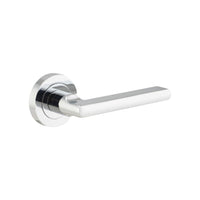 Pair of Iver Baltimore lever door handles on round rose, featuring a sleek metal finish and modern design for interior doors.