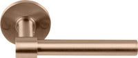 Pair of Formani ONE XL 15Ø lever handles on round rose, showcasing sleek modern design in polished finish.