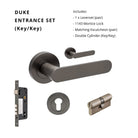 Close-up of Zanda Duke Lever Set in green finish, showing detailed handles and latch mechanism on a white background.