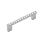 Stainless steel Momo Barletta cabinet pull handle mounted on a cabinet, featuring a sleek and modern design.