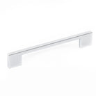 Momo LIVORNO cabinet pull handle with sleek metal design and curved shape, shown on a light wood cabinet.