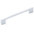 Momo LIVORNO cabinet pull handle in brushed gold finish mounted on a wooden cabinet door.