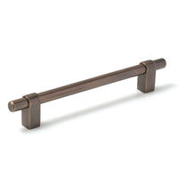 Momo MAIDA cabinet pull handle in brushed aluminum finish, mounted on a cabinet door for modern kitchen or furniture decor.