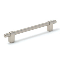 Momo MAIDA cabinet pull handle in dark bronze finish mounted on a cabinet door, showcasing modern kitchen hardware.