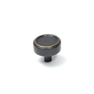 Momo Monaco cabinet knob with a sleek brushed brass finish, round shape, and modern design for furniture hardware.