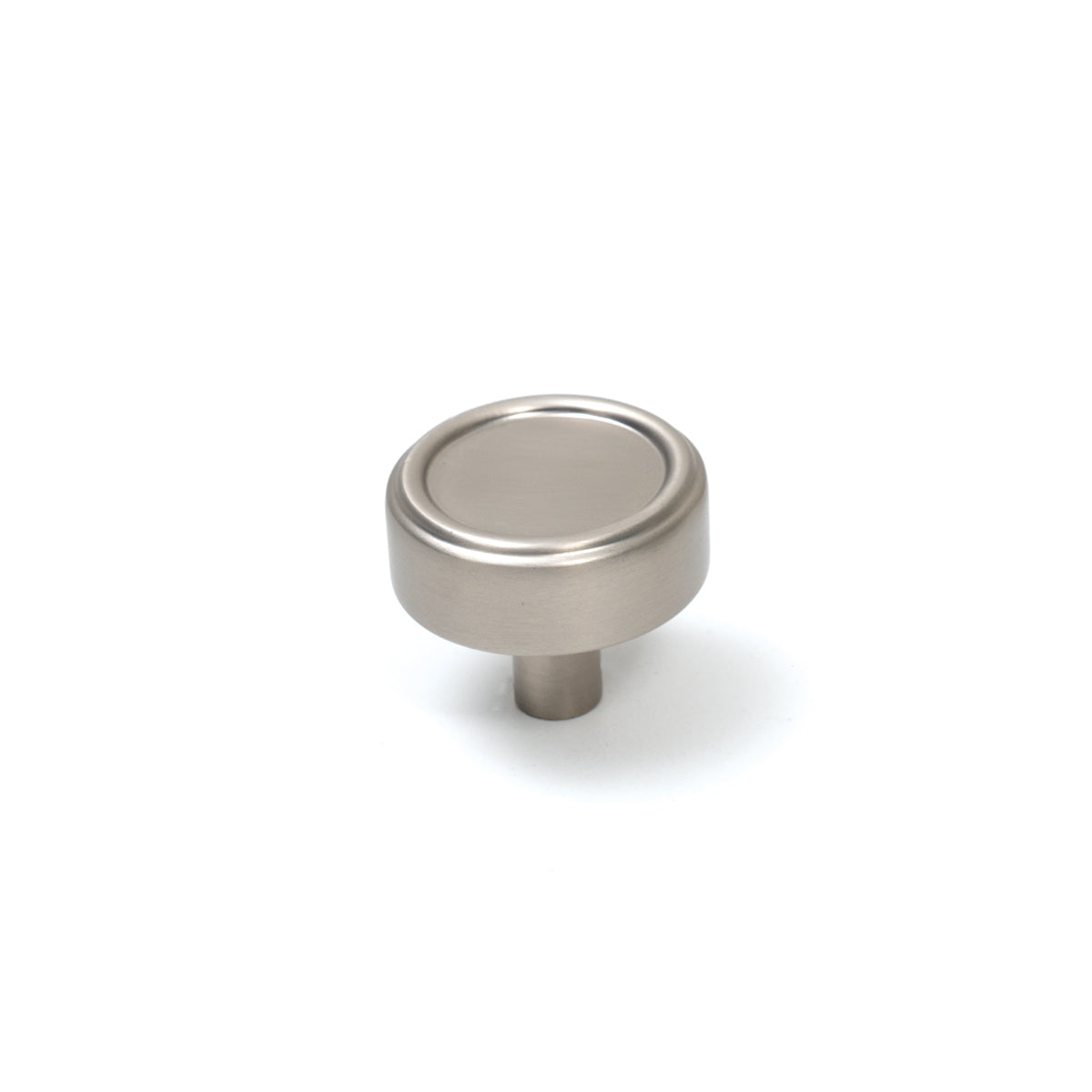 Momo Monaco cabinet knob in dark bronze finish, round metal handle mounted on a wooden cabinet door.
