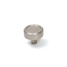 Momo Monaco cabinet knob in dark bronze finish, round metal handle mounted on a wooden cabinet door.