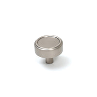 Momo Monaco cabinet knob in dark bronze finish, round metal handle mounted on a wooden cabinet door.