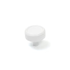 Momo Monaco cabinet knob in white with a rounded, modern design attached to a wooden cabinet door.