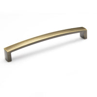Momo New Hampton cabinet pull handle in dark bronze finish mounted on a wooden cabinet door.