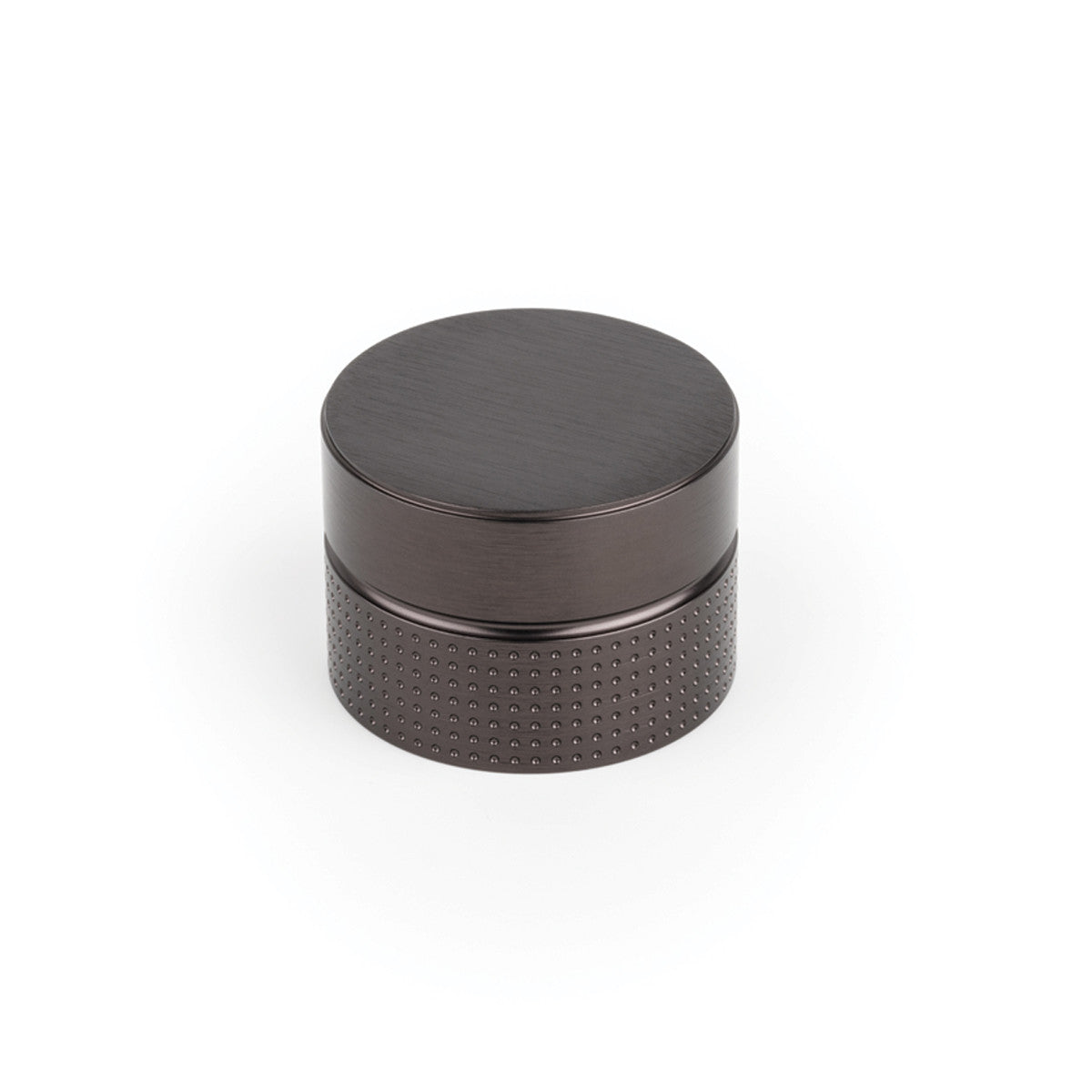 Momo POINT cabinet knob in textured black finish, featuring modern geometric design, mounted on a wooden cabinet door.