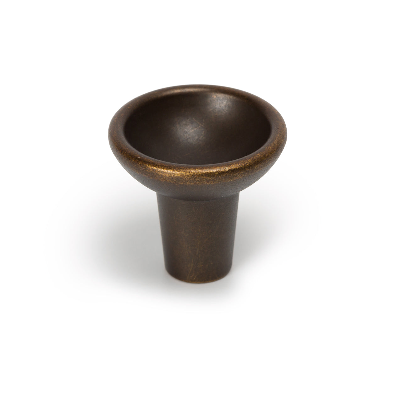 Momo RAVIOLO cabinet knob with a sleek, modern design in brushed metallic finish, mounted on a wooden cabinet.