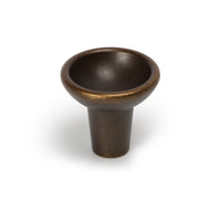 Momo RAVIOLO cabinet knob with a sleek, modern design in brushed metallic finish, mounted on a wooden cabinet.