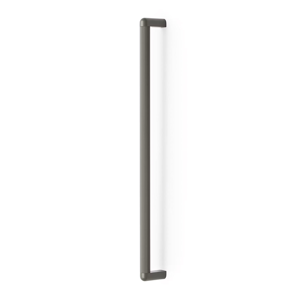 Momo RISS large cabinet pull handle in gray metal, mounted on a cabinet door for easy opening and stylish storage access.