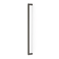 Momo RISS large cabinet pull handle in gray metal, mounted on a cabinet door for easy opening and stylish storage access.