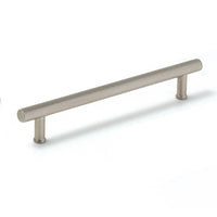 Momo STRANO cabinet pull handle in dark bronze finish mounted on a cabinet door.