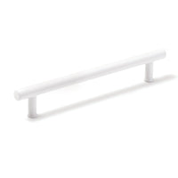 Momo STRANO cabinet pull handle in white finish, mounted on a modern cabinet door, showcasing sleek and stylish hardware design.