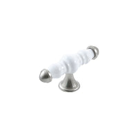 Momo Trianon ceramic cabinet T-pull handle in white and brown finish mounted on a cabinet door