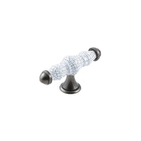White ceramic cabinet T-pull handle by Momo TRIANON, showcasing a sleek T-shaped design on a modern furniture piece.
