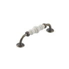 Momo Trianon ceramic cabinet pull handle in creamy beige with dark crackle finish, mounted on a cabinet door.