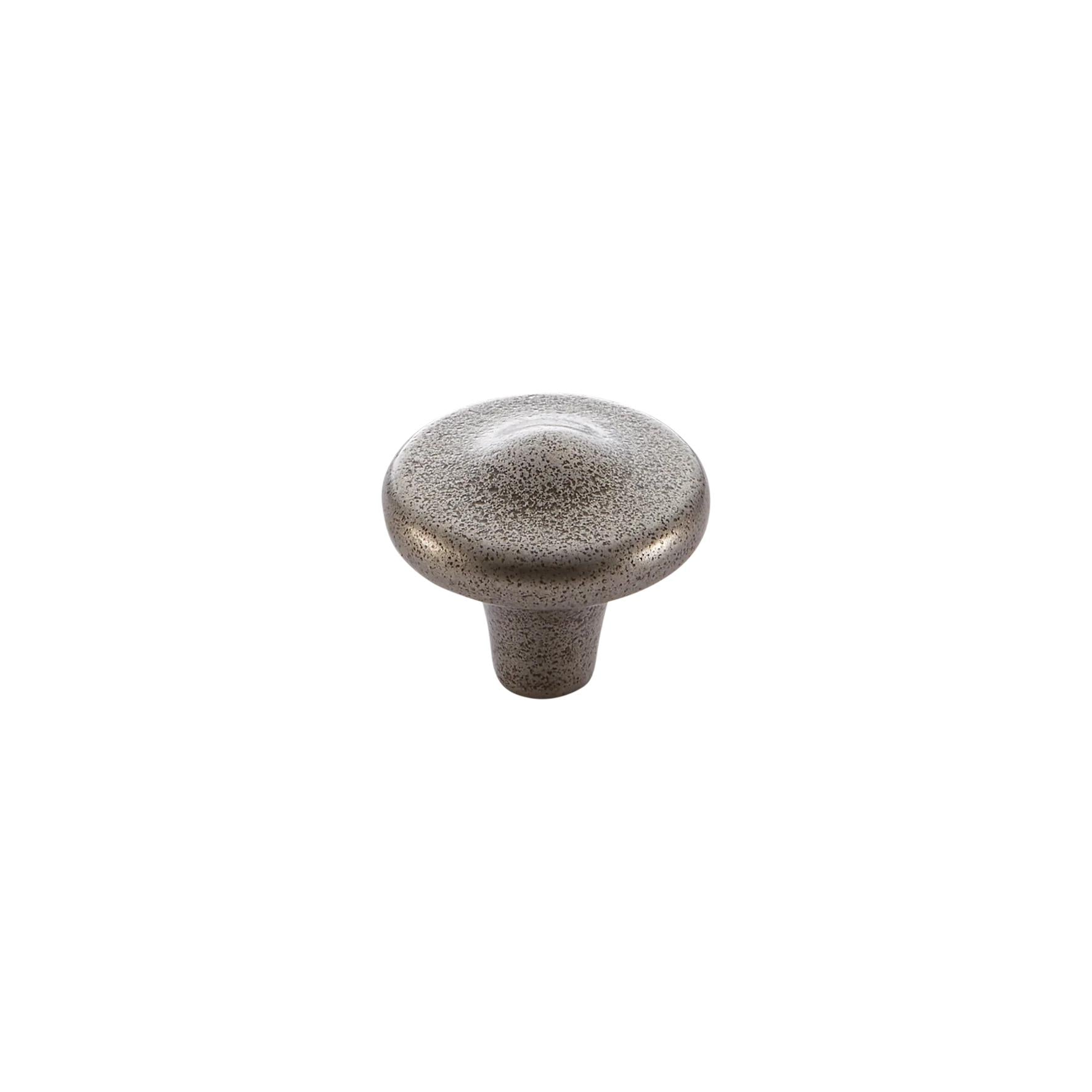 Momo Crosby round cabinet knob in white with a polished finish, mounted on a wooden drawer.