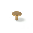 Momo VENA cabinet knob in black brushed finish with sleek modern design, mounted on a wooden cabinet door.