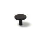 Momo VENA cabinet knob in matte black finish, round metal handle with sleek modern design, mounted on cabinet door.