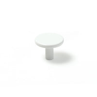 Momo VENA cabinet knob in white ceramic with sleek modern design, mounted on a wooden cabinet door.
