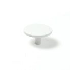 Momo VENA cabinet knob in white ceramic with sleek modern design, mounted on a wooden cabinet door.