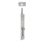 Windsor reverse barrel bolt installed on wooden door, showing metal latch and mounting hardware for security and privacy.