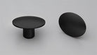 Kethy L845 Dome Cabinet Knob in matte black, round metal handle for kitchen or bathroom cabinets, close-up view.