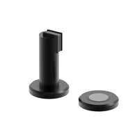 Black 530 Magnetic Door Stop and Holder by Style Finish Doorware mounted on a door and wall.