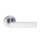 DormaKaba Madinoz Lever 014 door handle in satin chrome finish with sleek, modern design on a door.