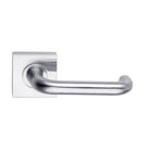 DormaKaba Madinoz Lever 018 door handle with sleek metal finish and ergonomic design on a modern door.