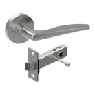 Castile door handle by Style Finish Doorware, showing a sleek brushed stainless steel lever on a door.