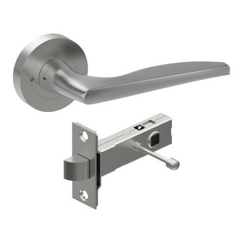 Castile door handle by Style Finish Doorware, showing a sleek brushed stainless steel lever on a door.