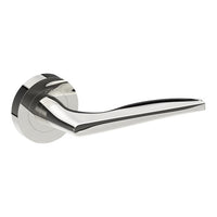 Castile door handle by Style Finish Doorware, polished stainless steel with a sleek, modern design mounted on a door.