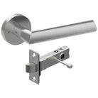 Style Finish Doorware COMO door handle in satin stainless steel, mounted on a modern door with a sleek, ergonomic design.